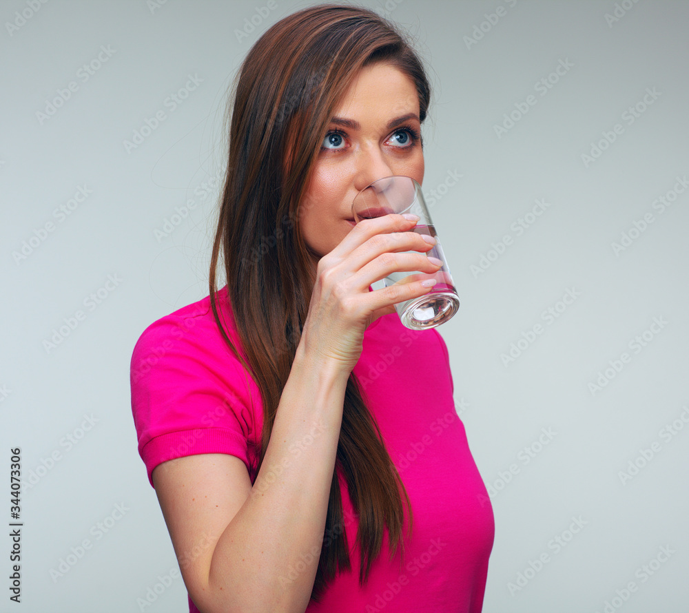 portrait of woman drinking water from glass.
