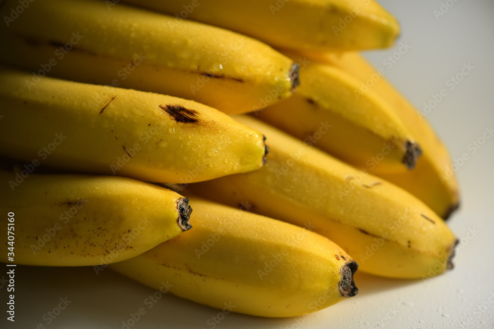 Bunch of raw ripe organic yellow bananas