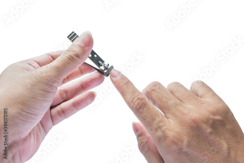 Hand doing with nail clipper on white background.