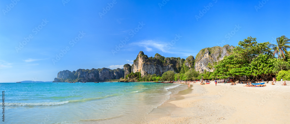 Turquoise crystal clear sea water with limestone cliff and mountain at Railay Beach, Krabi, Thailand