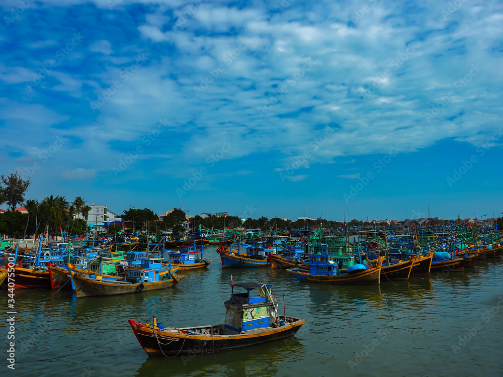many colorful boats on the water, vietnam