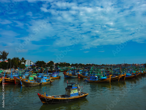 many colorful boats on the water, vietnam