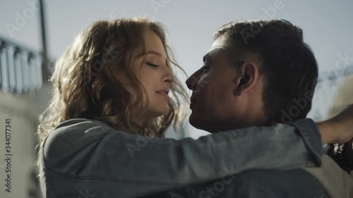 Hot couple, embracing and passionately kissing