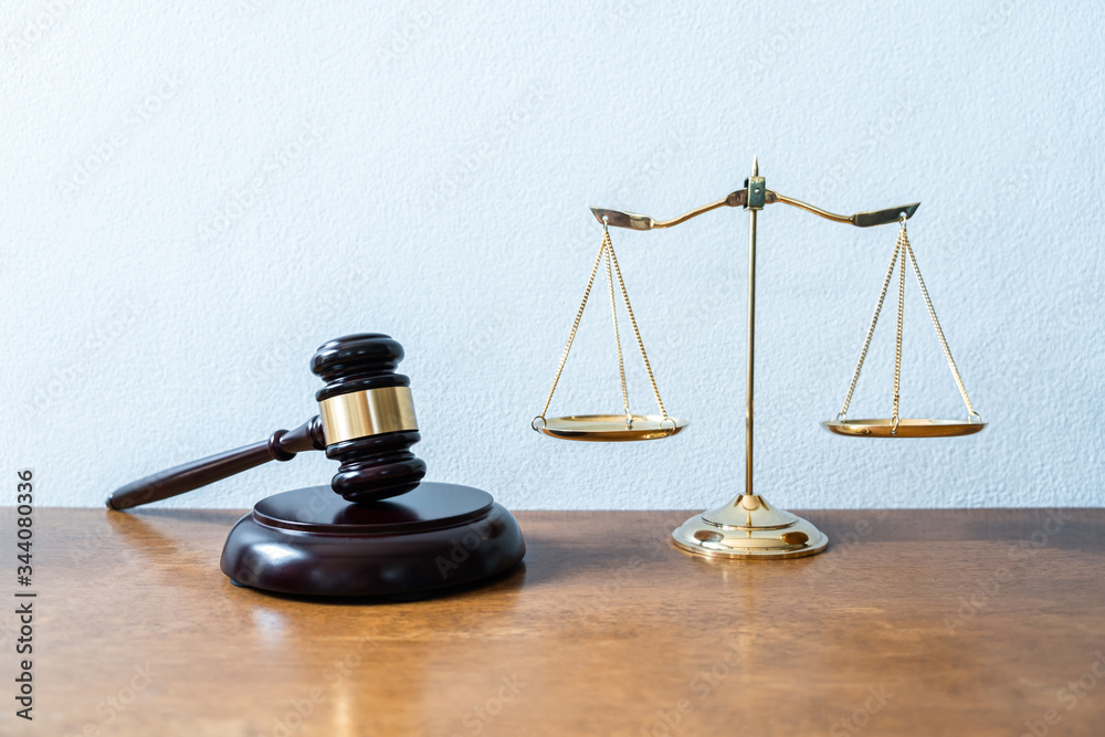 Image of Golden scales of justice and gavel for lawyer courtroom on the desk Image of Golden scales of justice and gavel for lawyer courtroom on the desk