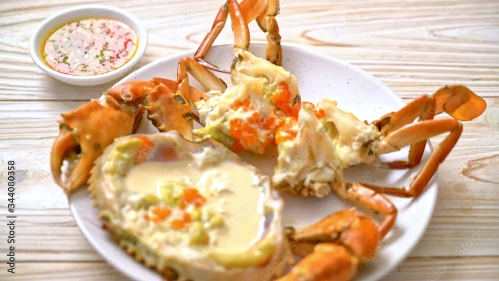 Steamed egg crab with fresh milk with spicy seafood sauce Steamed egg crab with fresh milk with spicy seafood sauce