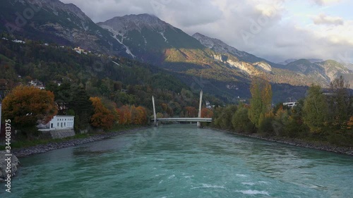 Modern funicular railway bridge crossing the river Inn in the historic city of Innsbruck. Austria photo