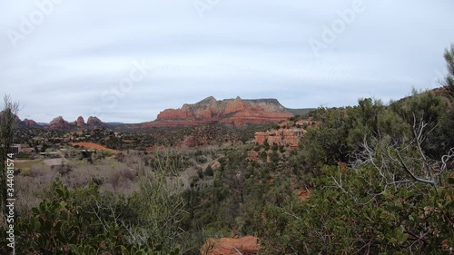 Time-Lapse view red rock formations, high desert, cactus, and chaparral in the foreground, Sedona, Arizona. photo