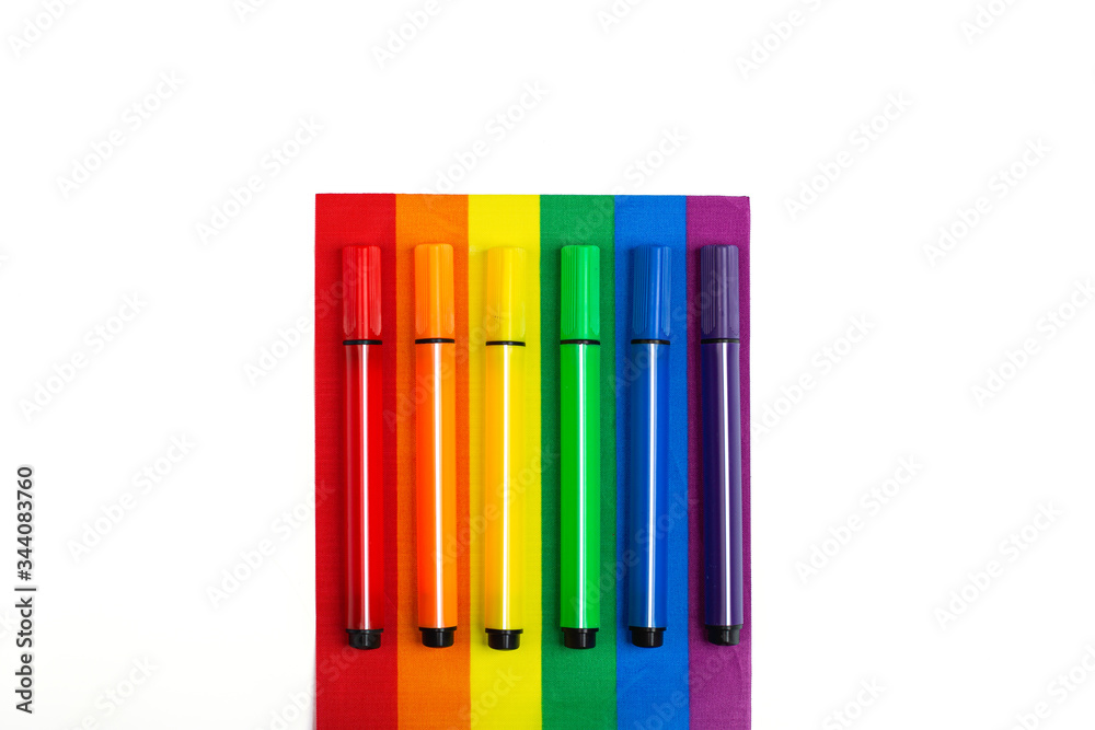 Mockup made with the LGBT pride flag and pencils. Concept of the Pride day, Valentine day, freedom, love. Flat lay, top view, template, overhead Mockup made with the LGBT pride flag and pencils. Concept of the Pride day, Valentine day, freedom, love. Flat lay, top view, template, overhead