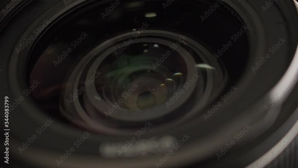 Close view of lens. Adjusting focus, aperture and exposure on dslr camera. Close view of lens. Adjusting focus, aperture and exposure on dslr camera.