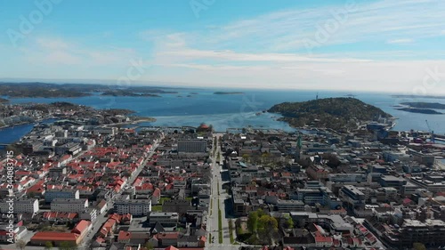 Aerial view Kristiansand, dolly out tilt down revealing lakes in forest photo