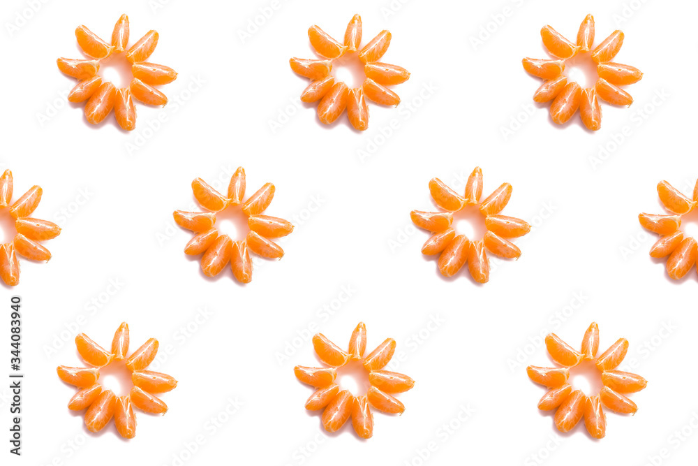 a pattern of Mandarin pieces laid out in the form of a flower on a white background