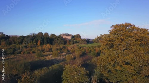 Aerial - flying forward drone view of a historic building in Airth, Scotland photo