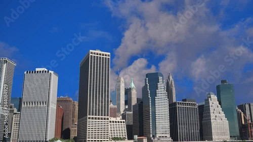 Time lapse shot of new york city skyline and running clouds in blue sky
