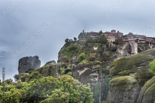 Foggy landscape of Mysterious hanging over rocks monasteries of Meteora  Greece