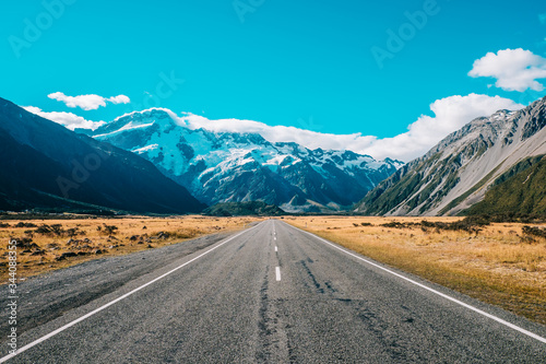 road leading to mountain with snow 