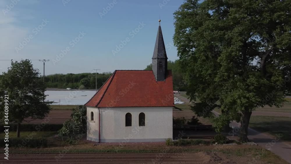 Little Chapel in the middle of farm fields on a beautiful day filmed from a drone Little Chapel in the middle of farm fields on a beautiful day filmed from a drone