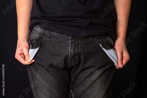 Moneyless Concept. Male Shows Empty Pockets