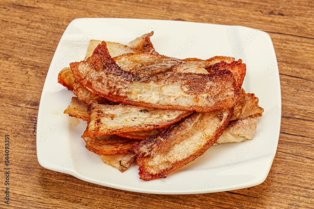 Roasted juicy bacon in the plate Roasted juicy bacon in the plate