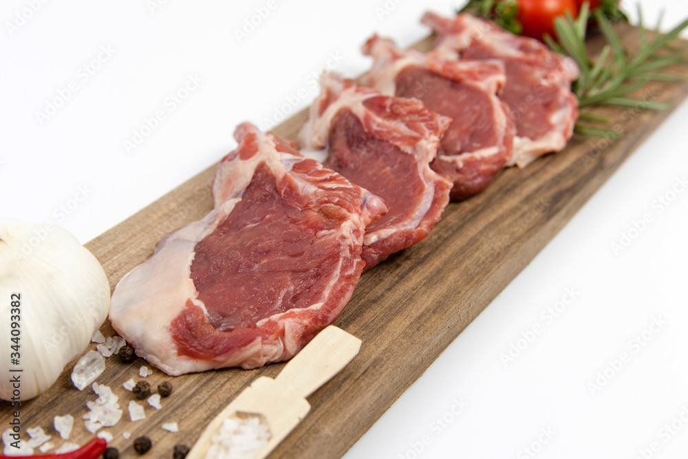 The white background is fresh lamb ribs on the serving table
The white background is fresh lamb ribs on the serving table
