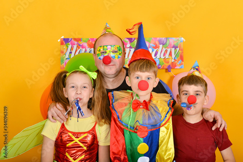 Dad celebrates a birthday with fairy clowns.