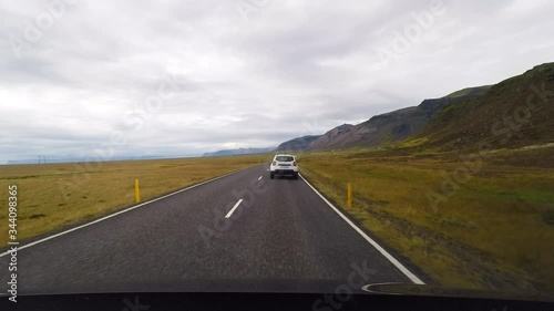 Point of view (POV) from inside the vehicle during driving at the main ring road in Iceland.