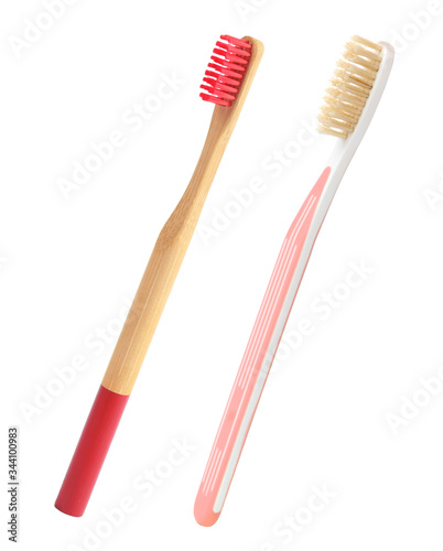 Different natural toothbrushes on white background