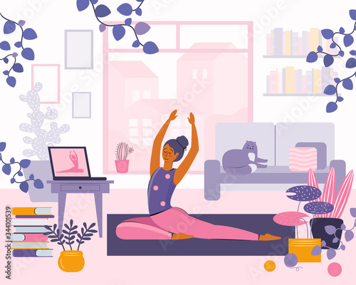 Stay home concept. Girl watching online classes on laptop, practicing yoga, meditation. Live stream, internet education. Woman doing exercises in cozy space modern interior. Spending time at home