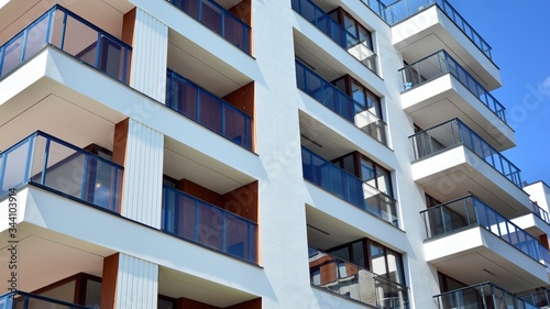 Residential Building on sky background. Facade of a modern housing construction with of balconies.