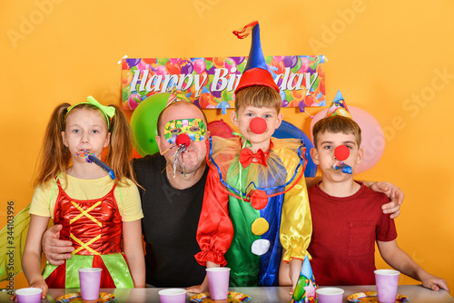 Dad celebrates a birthday with fairy clowns.