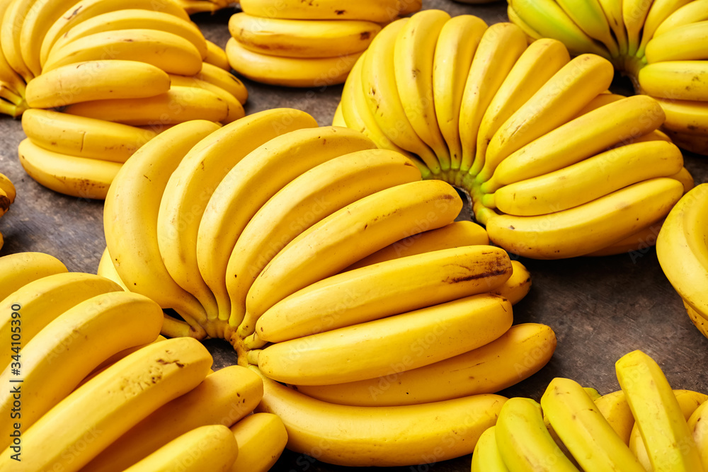 Natural ripe banana bunches on a local market, selective focus.