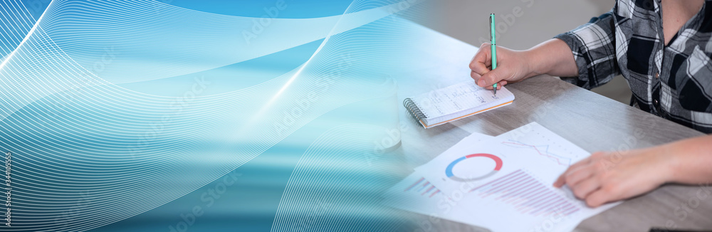 Woman analysing marketing data; panoramic banner Woman analysing marketing data; panoramic banner