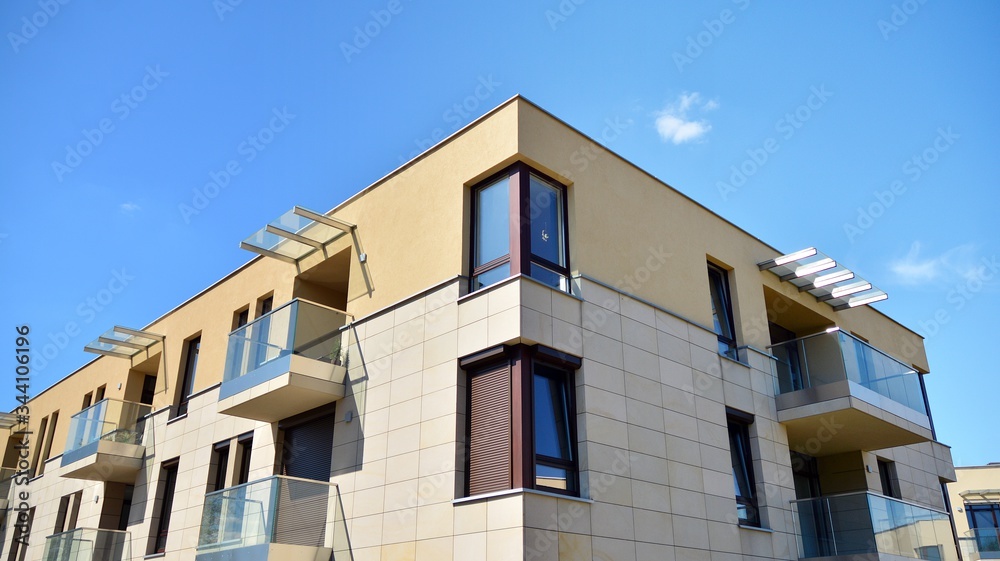 Residential Building on sky background. Facade of a modern housing construction with of balconies.