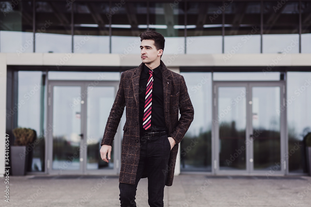 Handsome fashion man in black formal wear Handsome fashion man in black formal wear