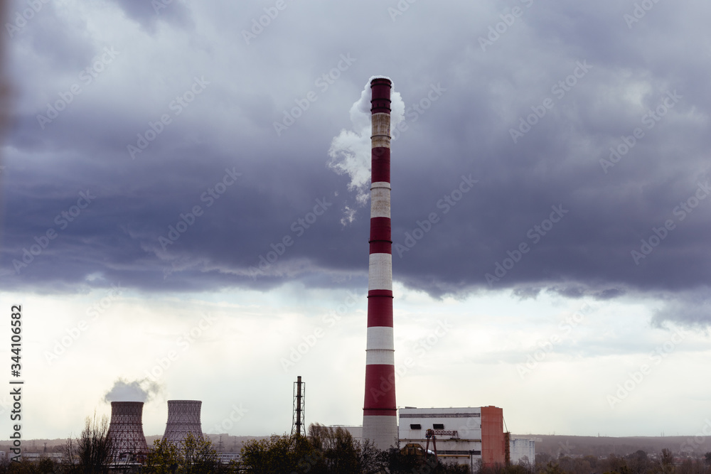 Powerful CHPP-5 in Kharkiv provides half of the city with heat and hot water. Strongly Smoking chimneys of thermal power plants. Pipe on the background of clouds. Ukraine