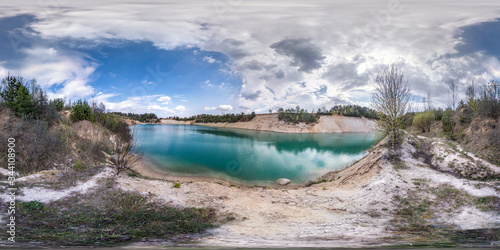 full seamless spherical hdri panorama 360 degrees angle view on limestone coast of huge green lake for sand extraction old mining with beautiful clouds in equirectangular projection, VR content