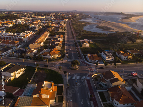 The marginal riverside, along the mouth of the Cavado River at sunset in Esposende, Portugal. The two sides of Restinga de Ofir. One facing the ocean, the other the estuary of Cávado River. photo