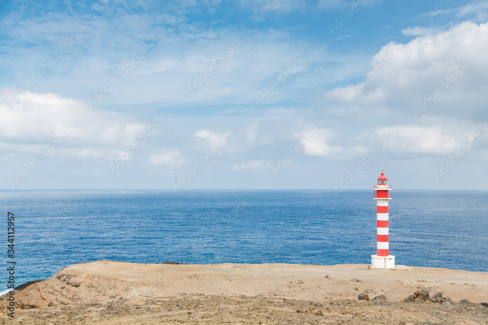 Lighthouse on Gran Canaria in daylight - Faro de Punta Sardina on cliffs
