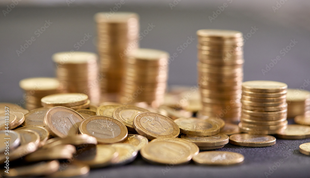 Stock Photo - Euro coins. Euro money. Euro currency.Coins stacked on each other in different positions. Money concept Stock Photo - Euro coins. Euro money. Euro currency.Coins stacked on each other in different positions. Money concept
