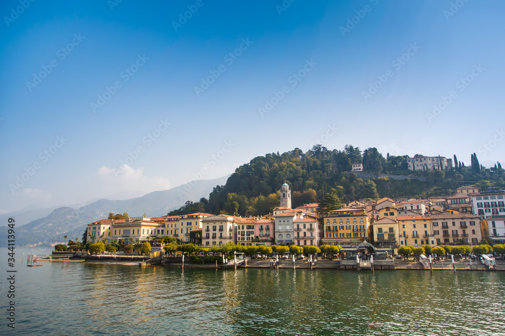 Colorful town Varenna seen from Lake Como on a sunny day Colorful town Varenna seen from Lake Como on a sunny day