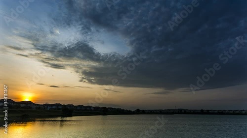 4K timelapse footage of dramatic movement of clouds with beautiful sunrise at the background. 