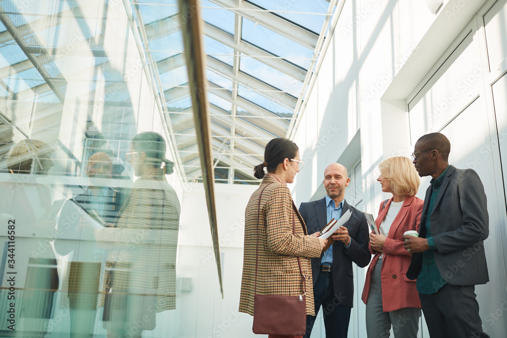 Group of business people meeting each other at office building they standing and talking Group of business people meeting each other at office building they standing and talking