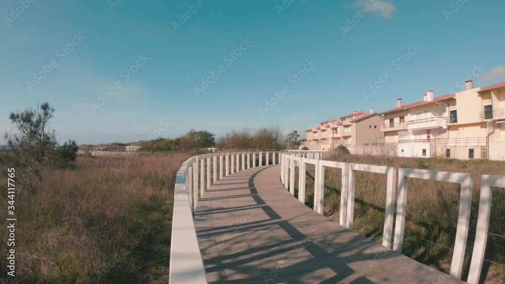 Ecovia Litoral Norte (North Coast Ecoway), wooden boardwalk in Esposende, Portugal. Pathway to the beach. Ecovia Litoral Norte (North Coast Ecoway), wooden boardwalk in Esposende, Portugal. Pathway to the beach.