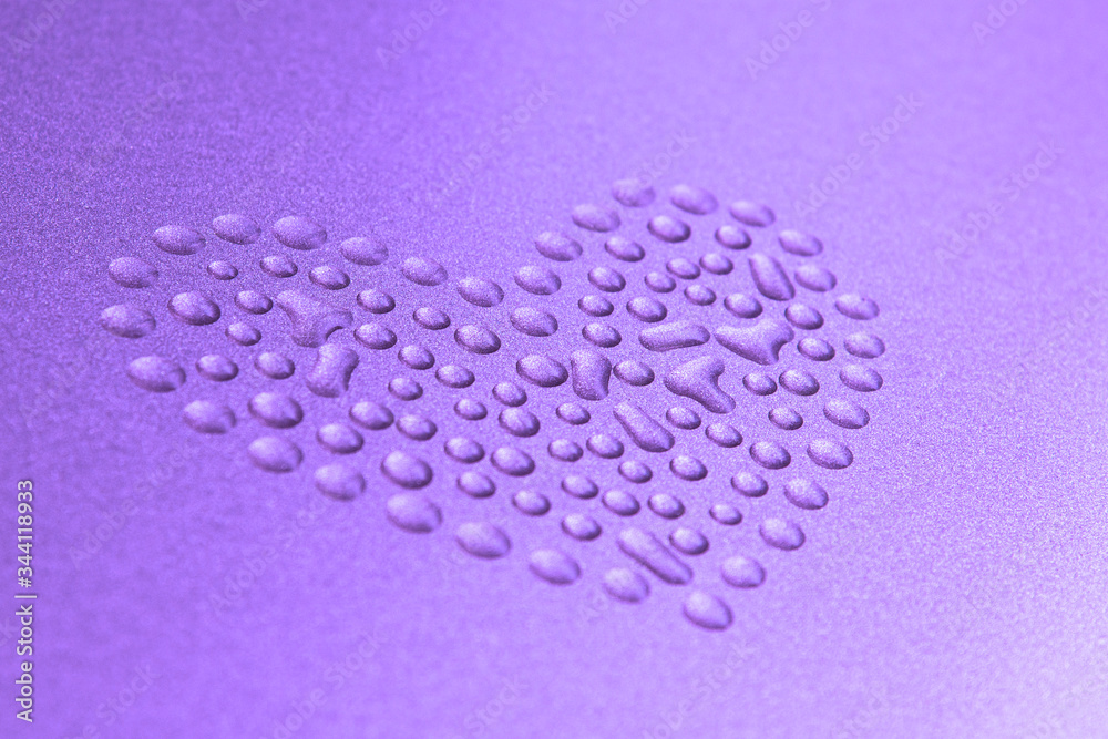 Blurry heart from water drops on metal surface Blurry heart from water drops on metal surface