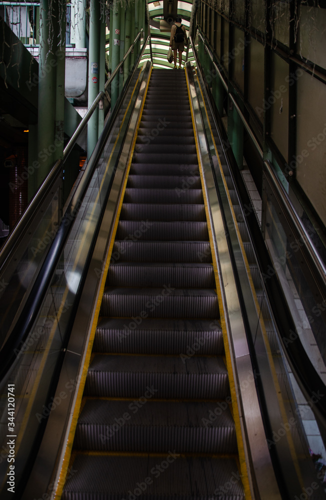Fototapeta premium moving escalator no people stay at home