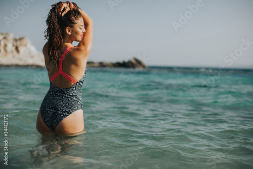 Young woman walking in the ...