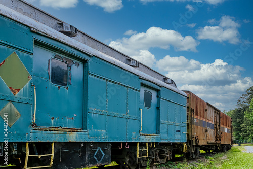 An old abandoned railroad train on tracks