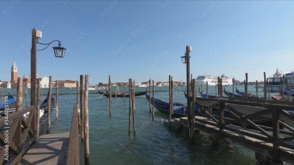 A large cruise ship sails past the Piazza San Marco (St Mark`s Square) in Venice. San Marco is the main landmark of Venice. Romantic travel across Venice, Italy.