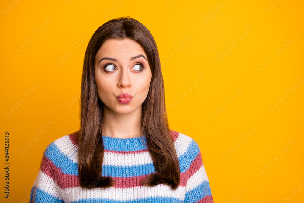 Closeup photo of attractive funny pretty lady flirty look side empty space flirting with handsome cute guy wear casual striped sweater isolated bright yellow color background Closeup photo of attractive funny pretty lady flirty look side empty space flirting with handsome cute guy wear casual striped sweater isolated bright yellow color background
