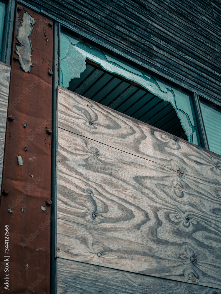 Old dilapidated building with broken window big enough to fit through ...