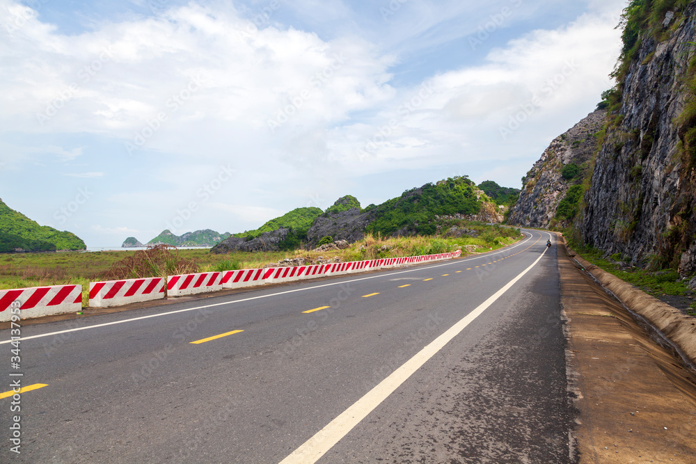 Mountain road among the hills on the island of Kat Ba, North Vietnam. Mountain road among the hills on the island of Kat Ba, North Vietnam.